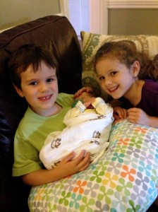 Here's Colin and Addie with their first baby cousin ever.