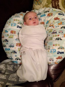 Love/hate relationship with this swaddle blanket aka the straight jacket.