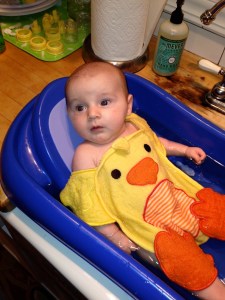 Loving bath time and his ducky.