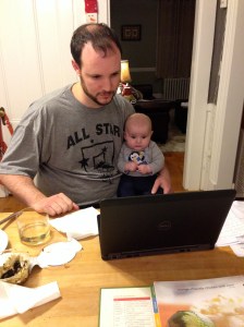 Helping Dad watch the PC game as Mom makes dinner.
