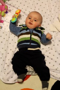 Just making music with my rattle.  I like to hold things and swing my arms around.