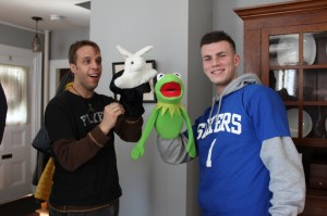 My crazy uncles are playing with my toys more than I am!