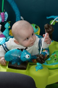 Around the 6 month mark Dermot really started noticing and playing with the animals on his exersaucer.